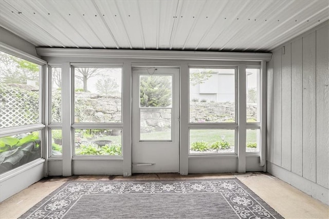 unfurnished sunroom featuring plenty of natural light