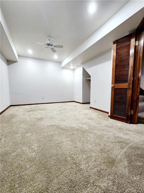 finished below grade area featuring carpet flooring, baseboards, and recessed lighting