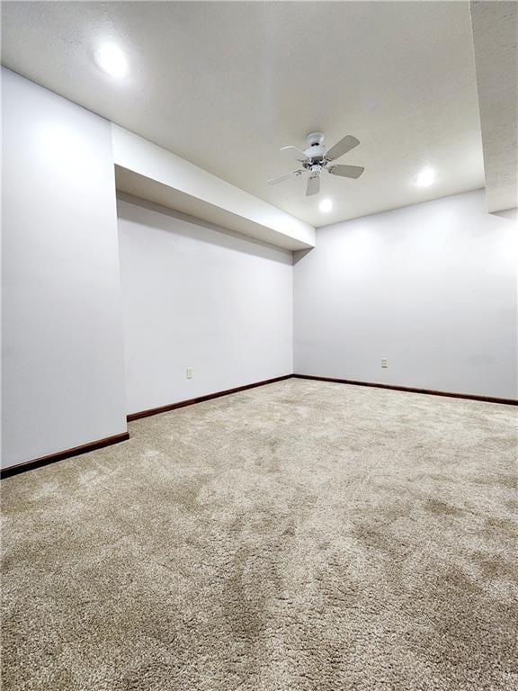 carpeted spare room with baseboards, recessed lighting, and a ceiling fan