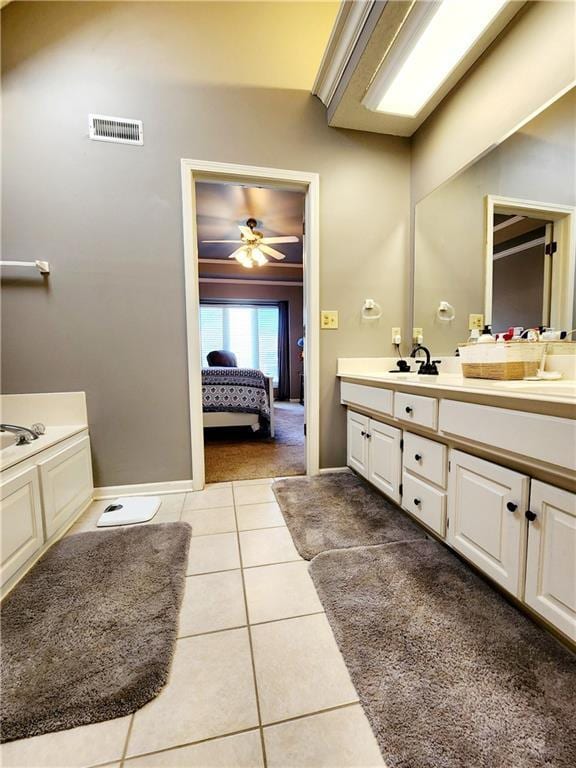 bathroom featuring visible vents, ceiling fan, ensuite bath, vanity, and tile patterned floors