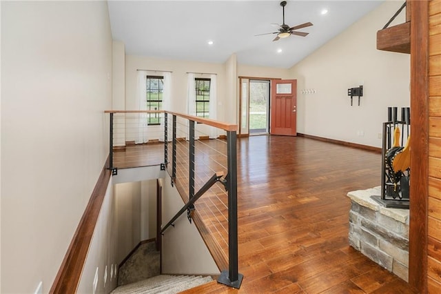 entrance foyer featuring vaulted ceiling, wood finished floors, ceiling fan, baseboards, and recessed lighting