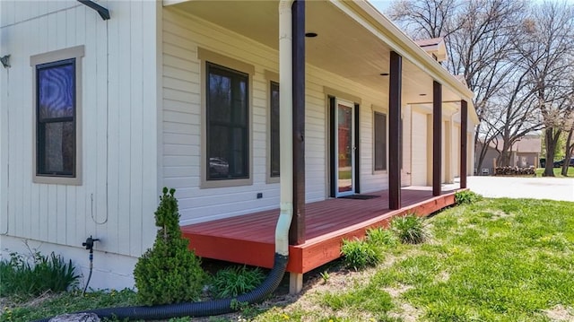 view of home's exterior featuring a yard and a porch