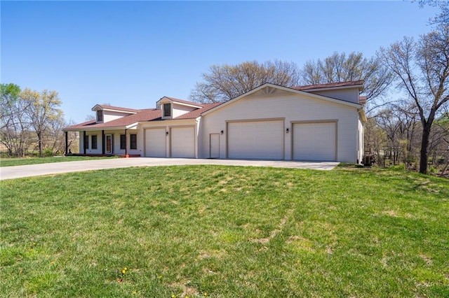 mediterranean / spanish-style house featuring a garage, a front lawn, and concrete driveway