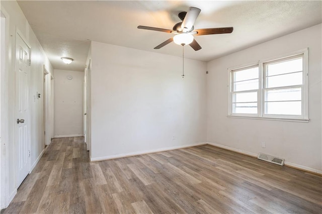 5431 Switzer Rd, Merriam, KS 66203 - spare room with wood finished floors and a ceiling fan