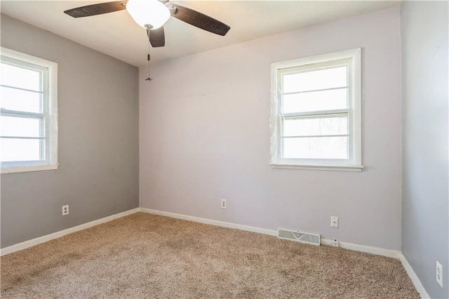 5431 Switzer Rd, Merriam, KS 66203 - carpeted empty room featuring healthy amount of natural light and ceiling fan