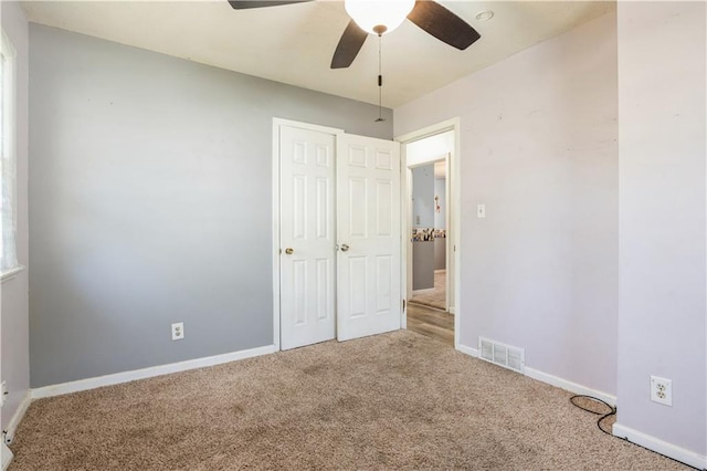 5431 Switzer Rd, Merriam, KS 66203 - unfurnished bedroom with carpet flooring, ceiling fan, and a closet