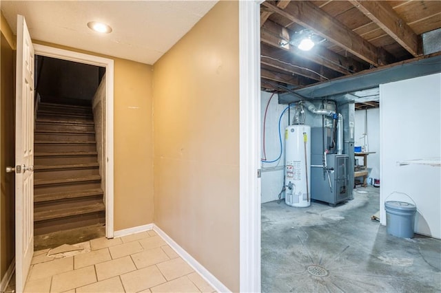 5431 Switzer Rd, Merriam, KS 66203 - basement featuring gas water heater, heating unit, and stairway