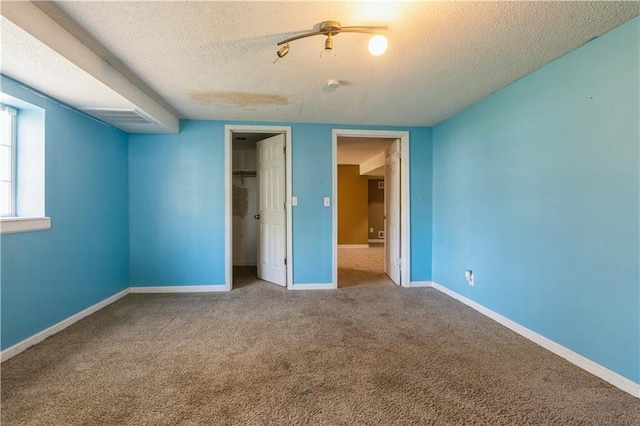 5431 Switzer Rd, Merriam, KS 66203 - unfurnished bedroom featuring a textured ceiling, carpet flooring, and a closet
