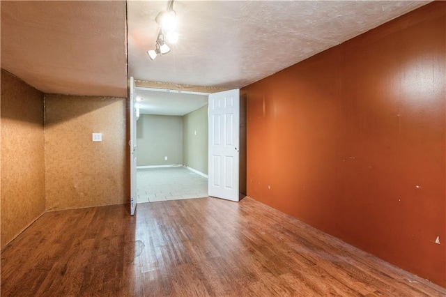 5431 Switzer Rd, Merriam, KS 66203 - unfurnished room featuring wood finished floors and a textured ceiling