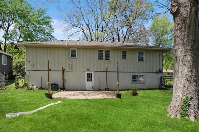 5431 Switzer Rd, Merriam, KS 66203 - back of house featuring a patio area, a yard, and board and batten siding