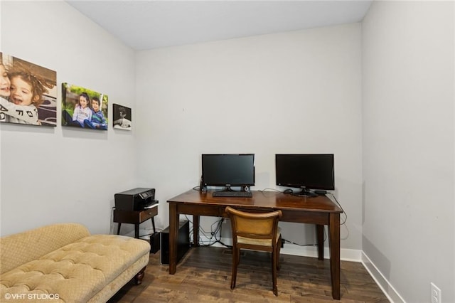 office space with baseboards and wood finished floors