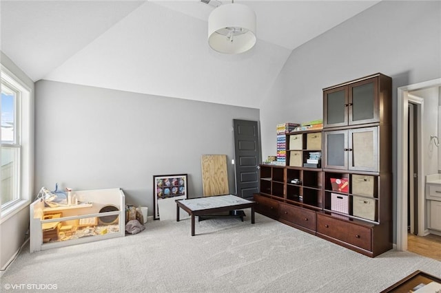 playroom with carpet and lofted ceiling
