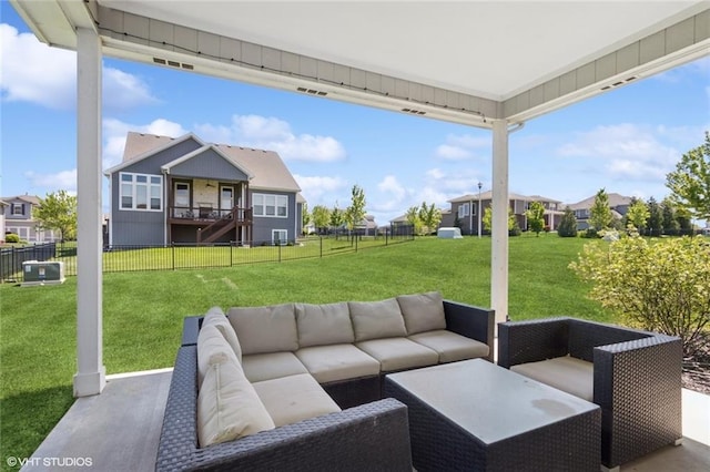 view of patio with outdoor lounge area, a residential view, and a fenced backyard
