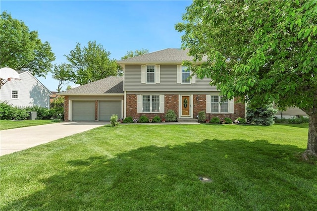 colonial house featuring an attached garage, driveway, a front lawn, and brick siding