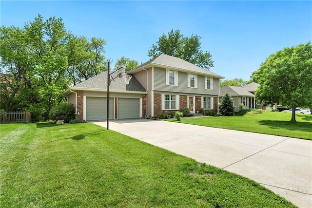 colonial home featuring a garage, a front yard, concrete driveway, and brick siding