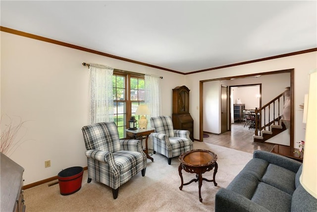 carpeted living area featuring stairway, crown molding, and baseboards