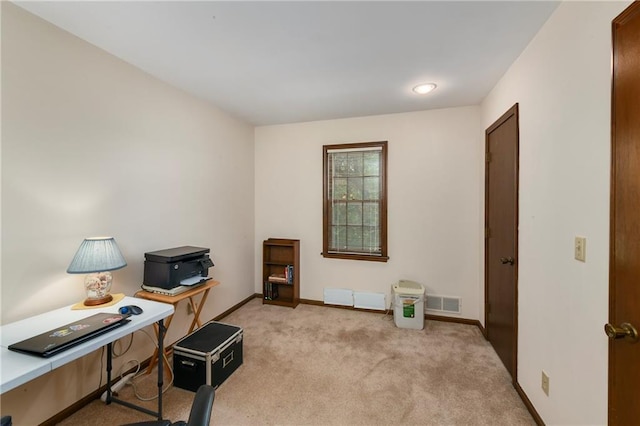 office with light colored carpet and baseboards