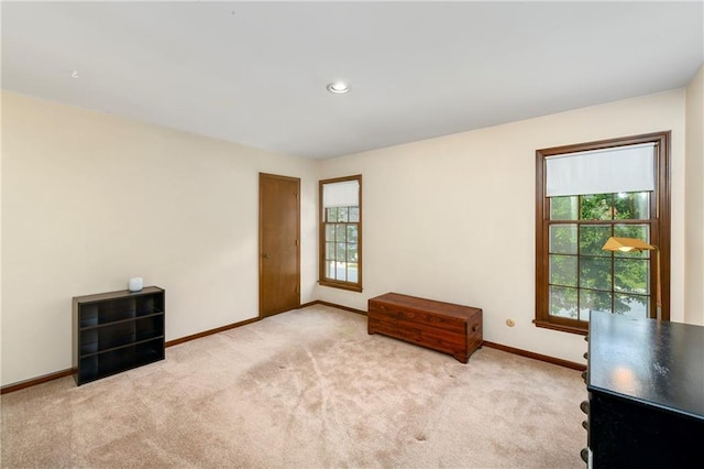 empty room with baseboards, carpet, and recessed lighting