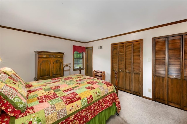 carpeted bedroom featuring two closets, crown molding, and heating unit