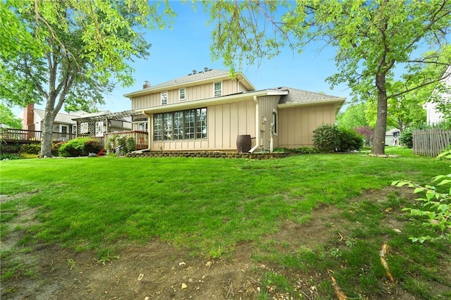 back of house with a wooden deck and board and batten siding
