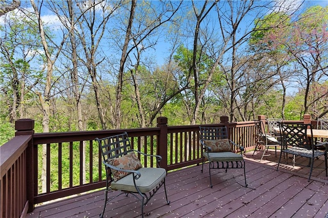 deck featuring outdoor dining area