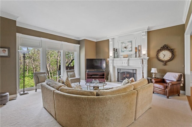 living area featuring baseboards, ornamental molding, a fireplace, and light colored carpet