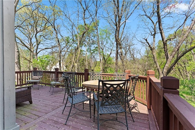 deck featuring outdoor dining area