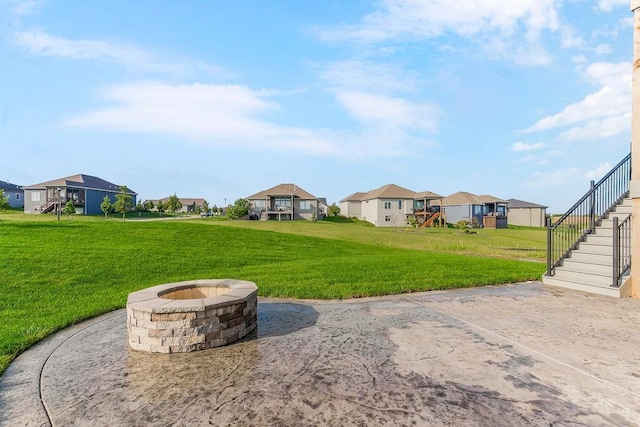 16159 S Kaw St, Olathe, KS 66062 - view of grassy yard with a residential view, a fire pit, and stairs