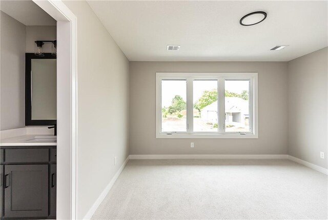 15381 W 162nd St, Olathe, KS 66062 - spare room featuring a sink, light carpet, and baseboards