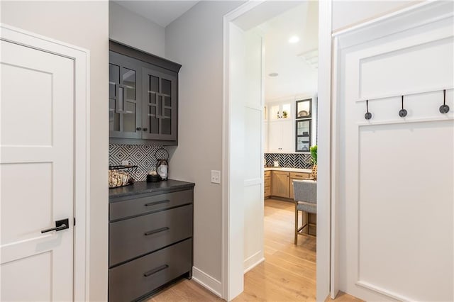 15436 W 161st Ter, Olathe, KS 66062 - bar featuring decorative backsplash, light wood finished floors, recessed lighting, and baseboards