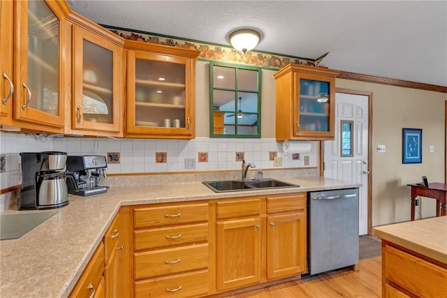 4955 Saratoga Dr, Mclouth, KS 66054 - kitchen with light countertops, backsplash, a ceiling fan, dishwasher, and a sink