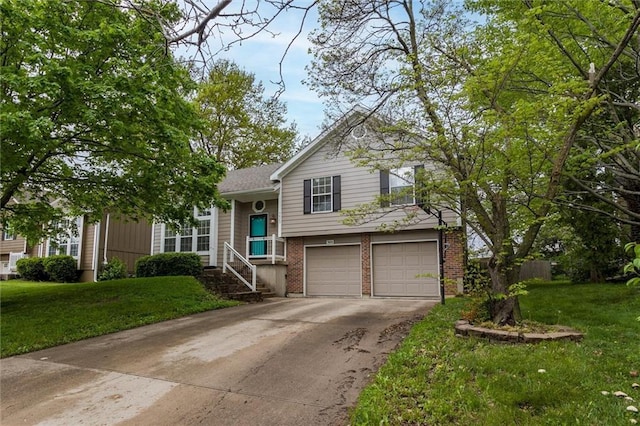 split level home featuring concrete driveway, brick siding, a front yard, and a garage