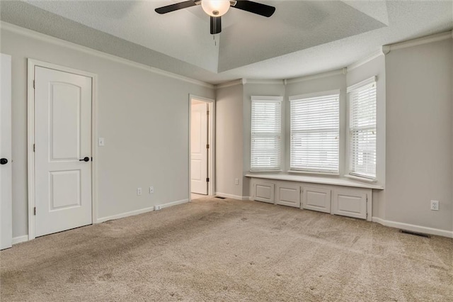 unfurnished bedroom featuring crown molding and light colored carpet