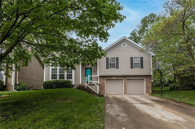 tri-level home featuring brick siding, an attached garage, driveway, and a front lawn