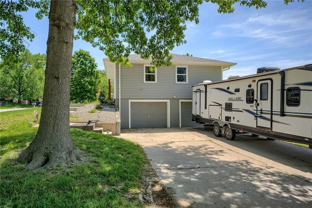 50 N 80th Pl, Kansas City, KS 66111 - view of front facade with an attached garage and concrete driveway