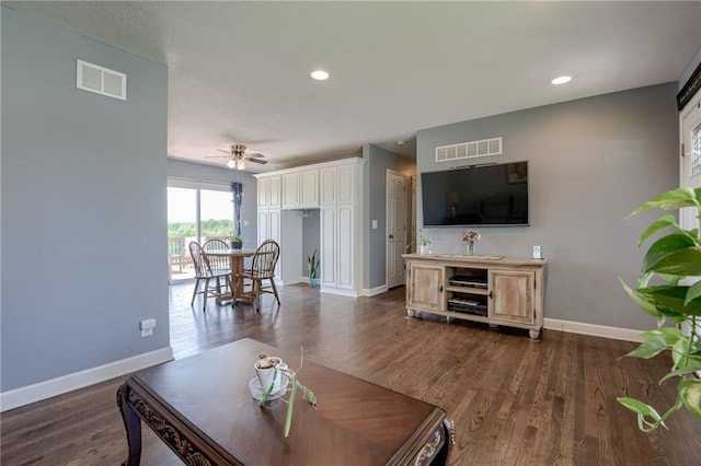 50 N 80th Pl, Kansas City, KS 66111 - living room featuring baseboards, dark wood-type flooring, a ceiling fan, and recessed lighting