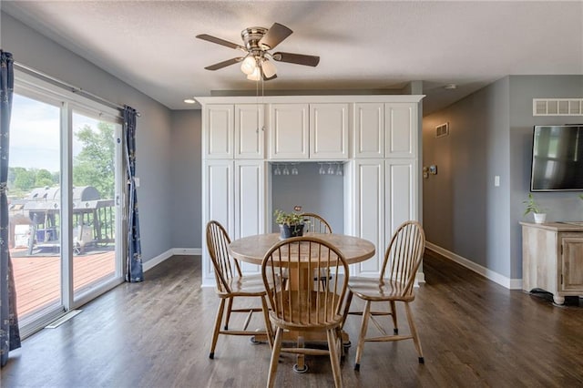 50 N 80th Pl, Kansas City, KS 66111 - dining area featuring baseboards, wood finished floors, and ceiling fan