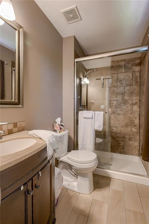 50 N 80th Pl, Kansas City, KS 66111 - bathroom featuring toilet, vanity, and a shower stall