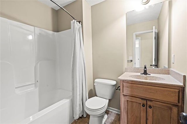 full bath with a textured ceiling, vanity, baseboards, shower / tub combo, and toilet