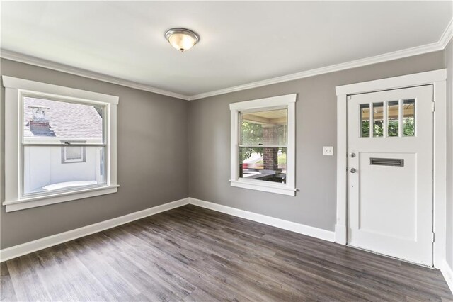 809 S Crysler Ave, Independence, MO 64052 - foyer featuring crown molding, dark wood-style flooring, and baseboards