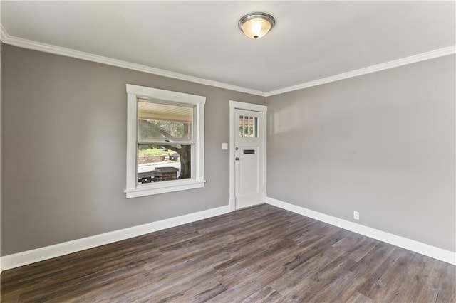 809 S Crysler Ave, Independence, MO 64052 - entryway with crown molding, baseboards, and wood finished floors