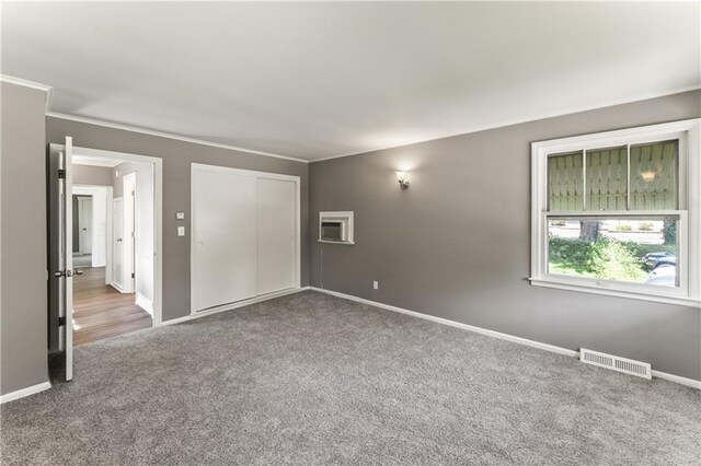 809 S Crysler Ave, Independence, MO 64052 - empty room with carpet, baseboards, and crown molding
