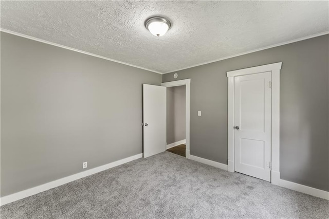 809 S Crysler Ave, Independence, MO 64052 - unfurnished bedroom featuring carpet floors, crown molding, baseboards, and a textured ceiling