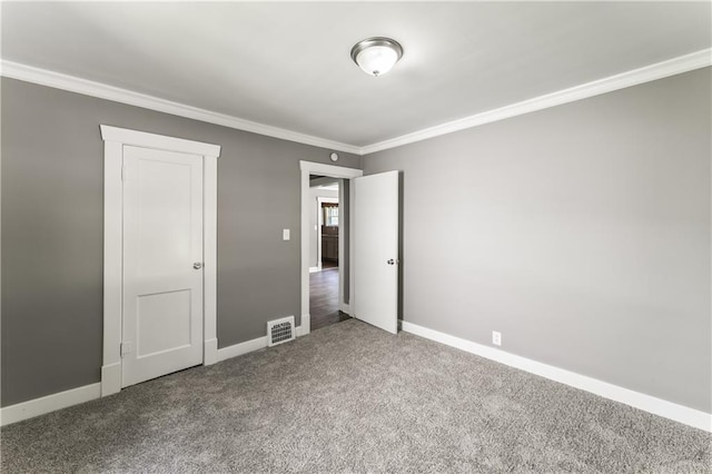 809 S Crysler Ave, Independence, MO 64052 - unfurnished bedroom featuring carpet, ornamental molding, and baseboards