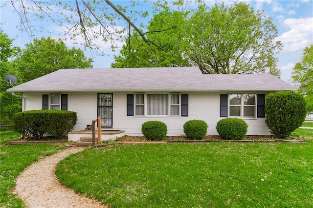 ranch-style home with a front lawn