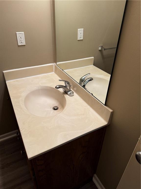 425 Hawthorne I Blvd, Warrensburg, MO 64093 - bathroom with vanity and wood finished floors
