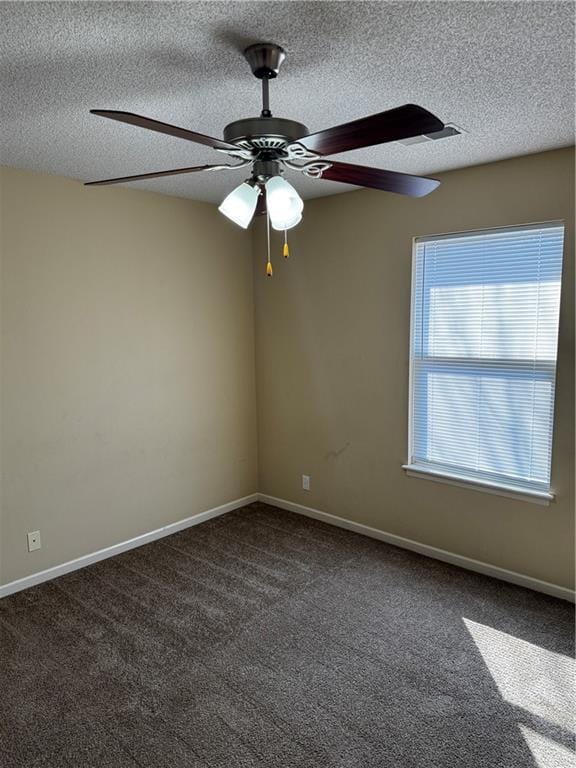 425 Hawthorne I Blvd, Warrensburg, MO 64093 - carpeted spare room featuring ceiling fan, baseboards, and a textured ceiling