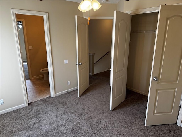 425 Hawthorne I Blvd, Warrensburg, MO 64093 - unfurnished bedroom with baseboards and carpet floors