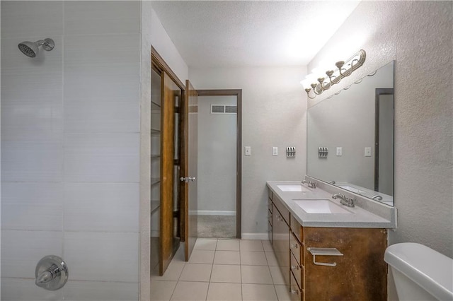 full bathroom featuring tile patterned flooring, visible vents, a sink, and toilet