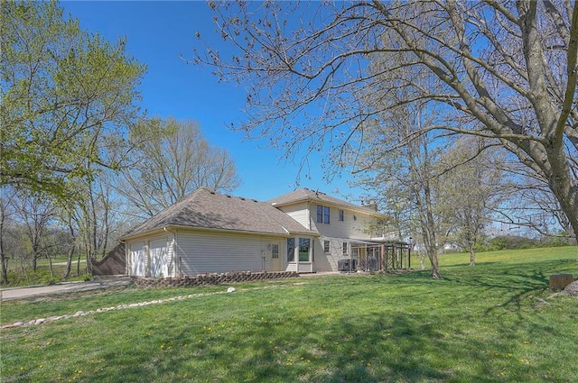 exterior space featuring a yard, an attached garage, and concrete driveway